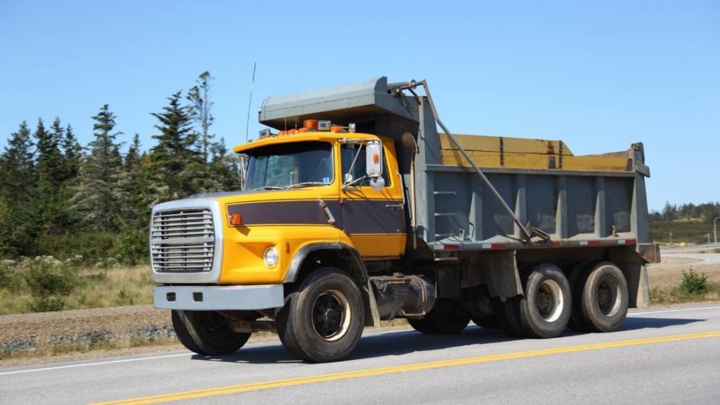 best load boards for dump trucks image of yellow dump truck on road
