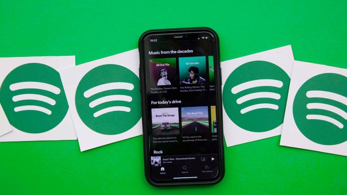 Can you make money from spotify playlists image of phone with playlist