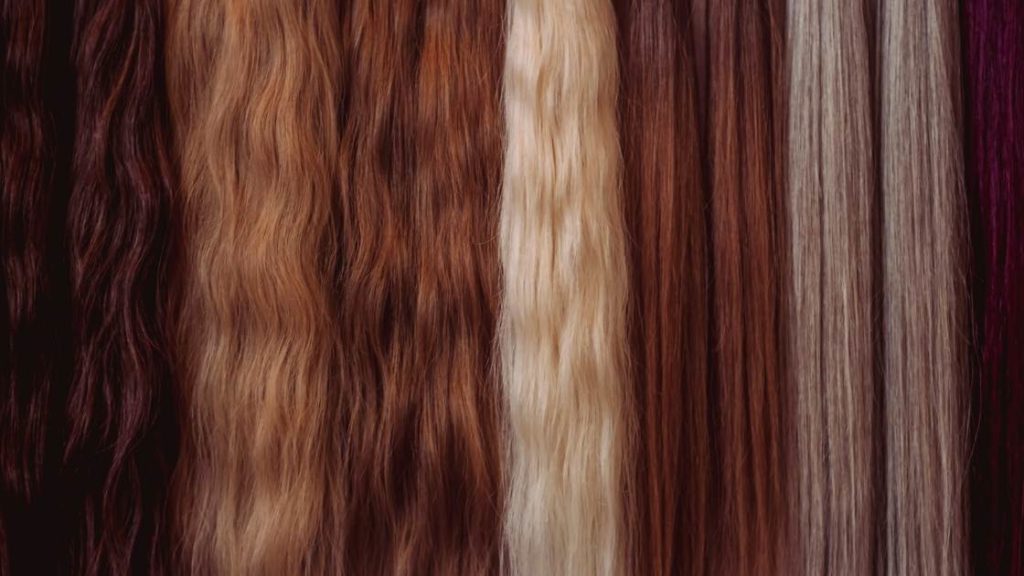 how to start a hair extension business image of various hair extensions in a row