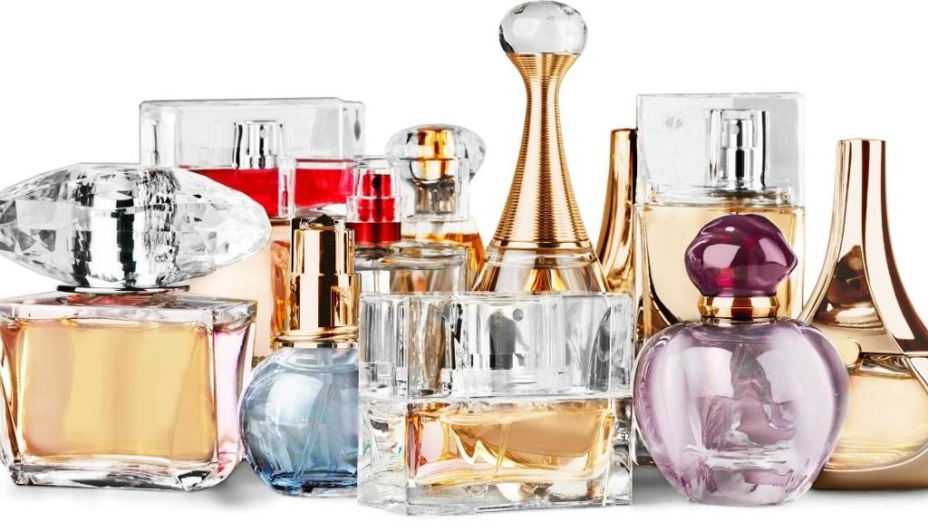 how to start a perfume business image of multiple bottles of perfume